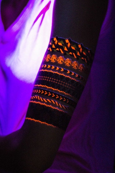 Friendship Bracelet Temporary Tattoo Neon Glow under Black Light Festival and Club. Colorful and Fun. Geometric shapes